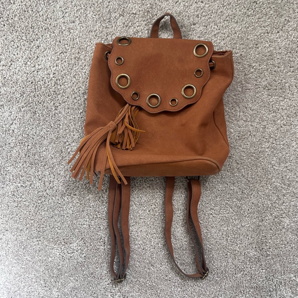 Elegant Tan Backpack with Tassel Accents